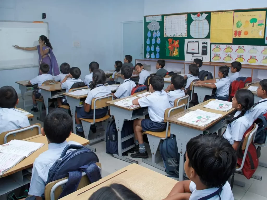 Students in a classroom learning with a teacher at one of the best ICSE schools in Bangalore